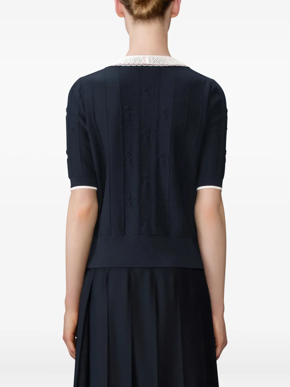 Navy top worn by a person, showing the top fit