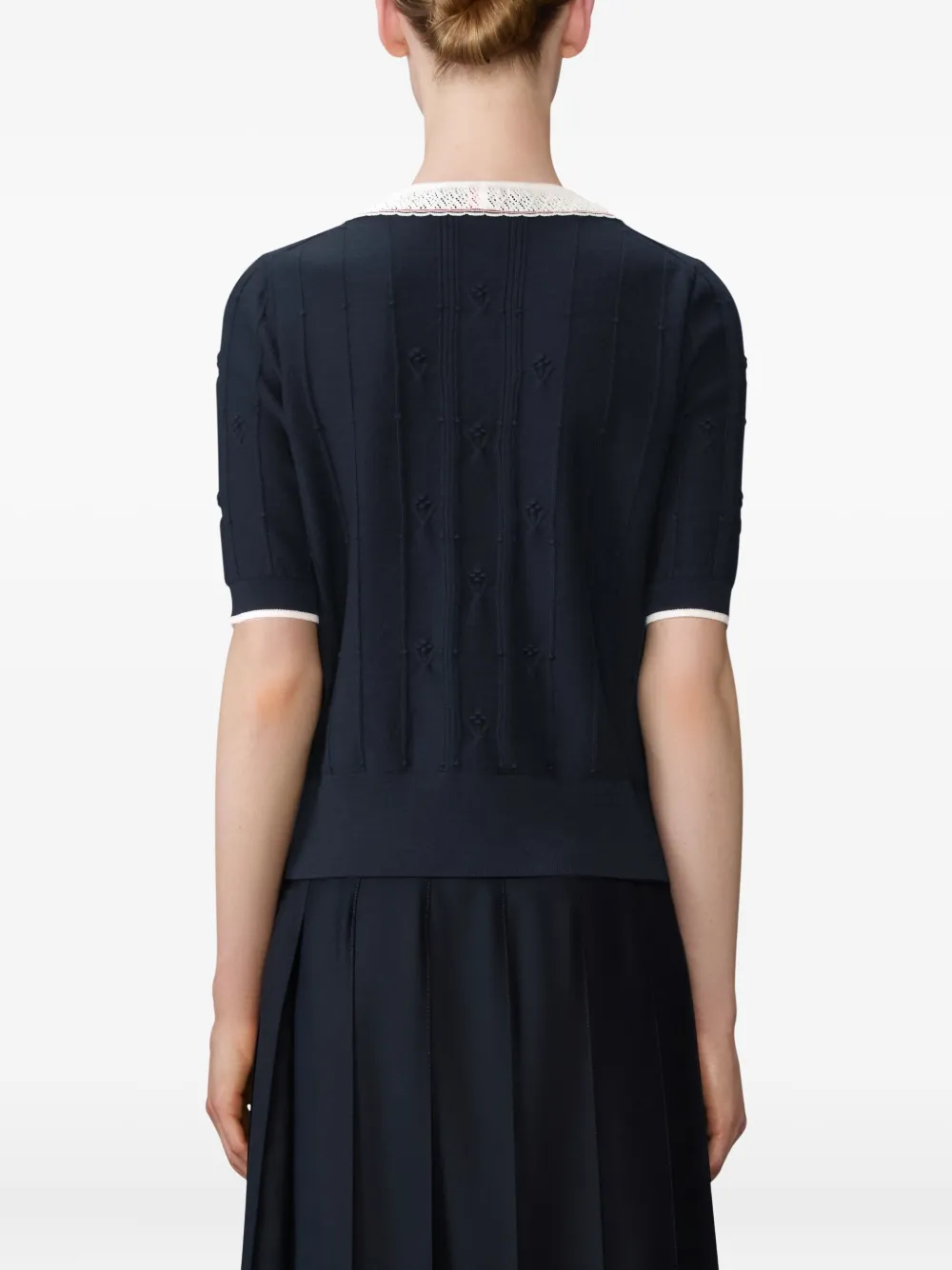 Navy top worn by a person, showing the top fit