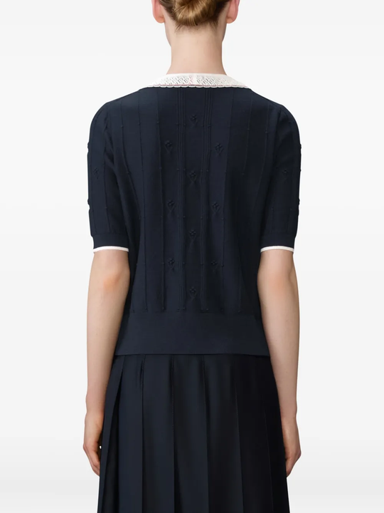 Navy top worn by a person, showing the top fit