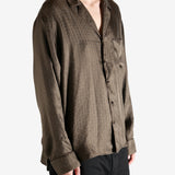 Brown shirt worn by a person, showing the shirt's fit