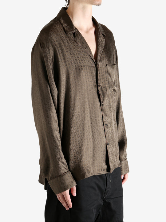 Brown shirt worn by a person, showing the shirt's fit