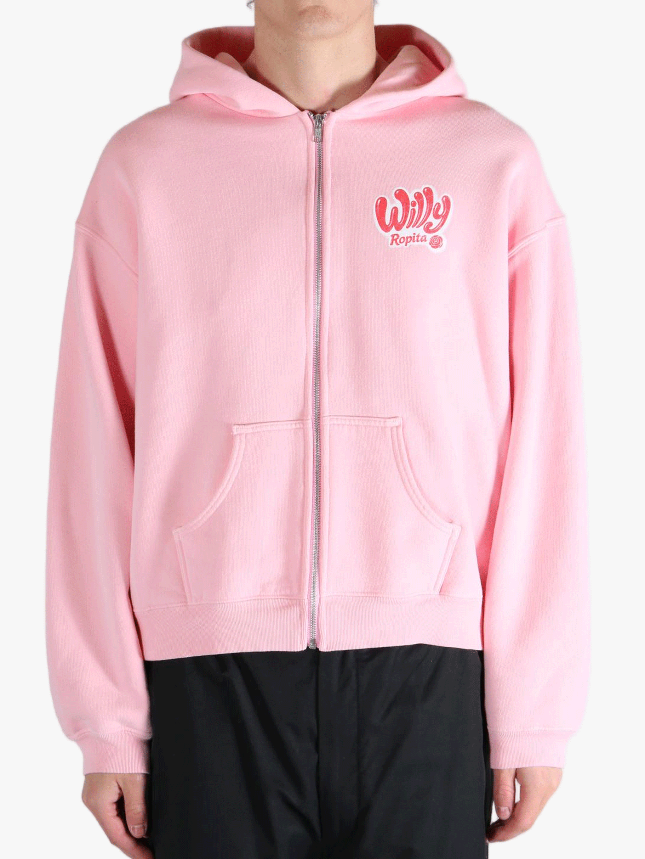Pink hoodie worn by a person, showing the hoodie's fit
