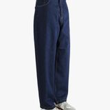 Blue pant worn by a person, showing the pant's fit