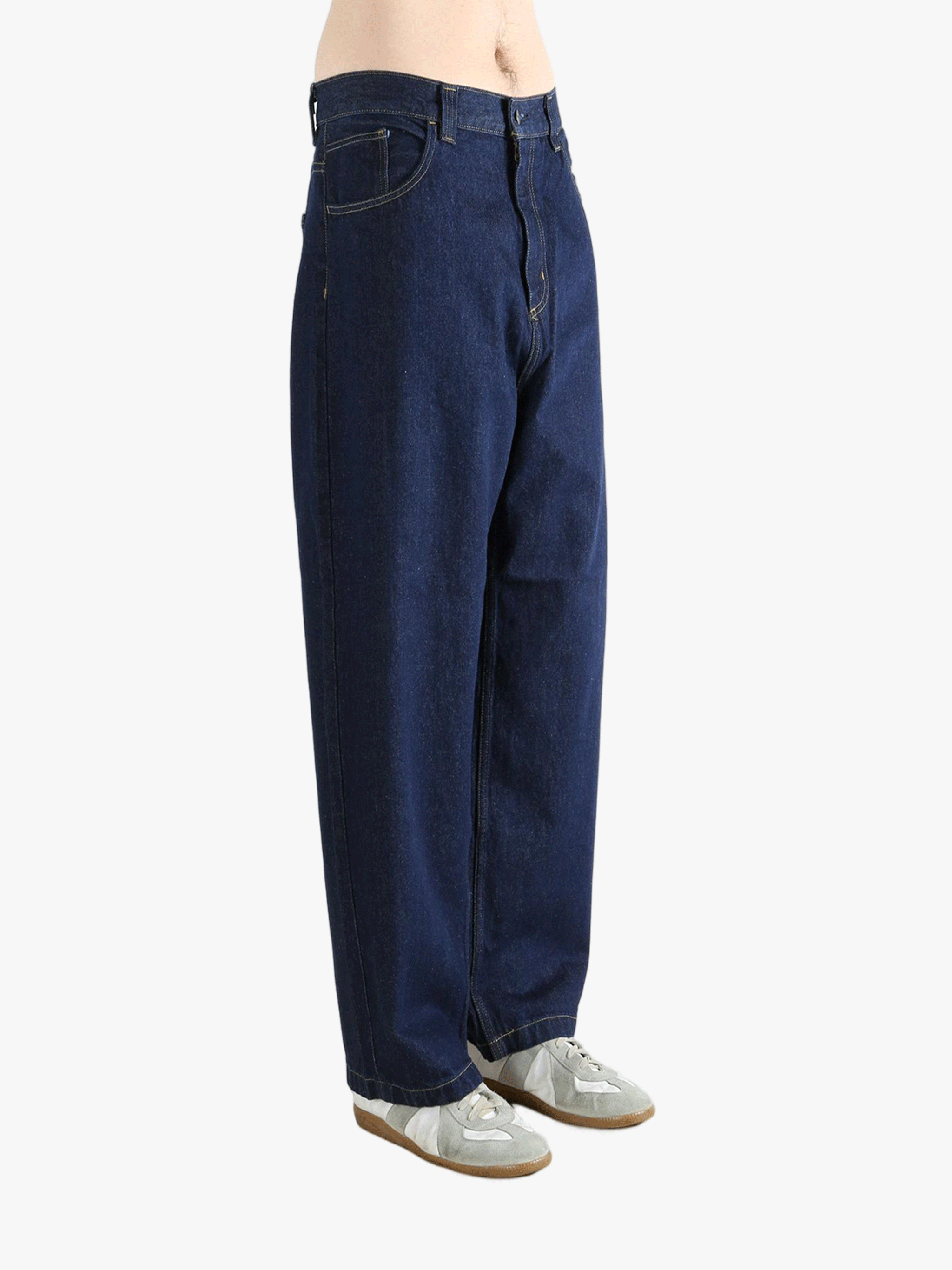 Blue pant worn by a person, showing the pant's fit