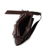 Close up of brown bag, showing texture of the leather fabric