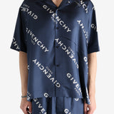 Navy shirt worn by a person, showing the shirt's fit