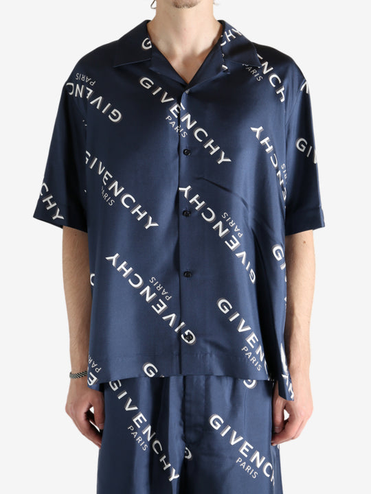 Navy shirt worn by a person, showing the shirt's fit