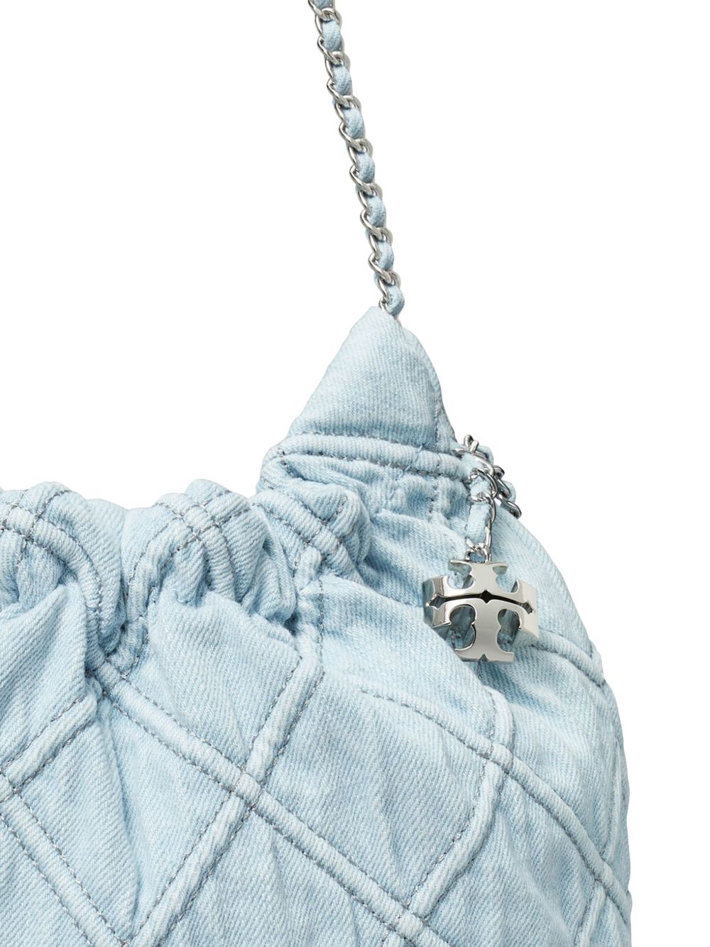 Close up of blue bag, showing texture of the napa leather and cotton fabric