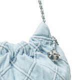 Close up of blue bag, showing texture of the napa leather and cotton fabric