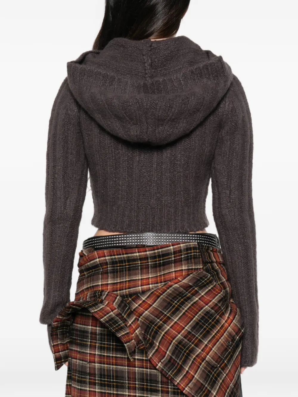 Brown knitwear worn by a person, showing the knitwear fit