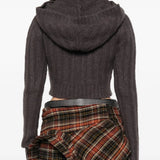 Brown knitwear worn by a person, showing the knitwear fit