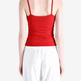 Red top worn by a person, showing the top fit