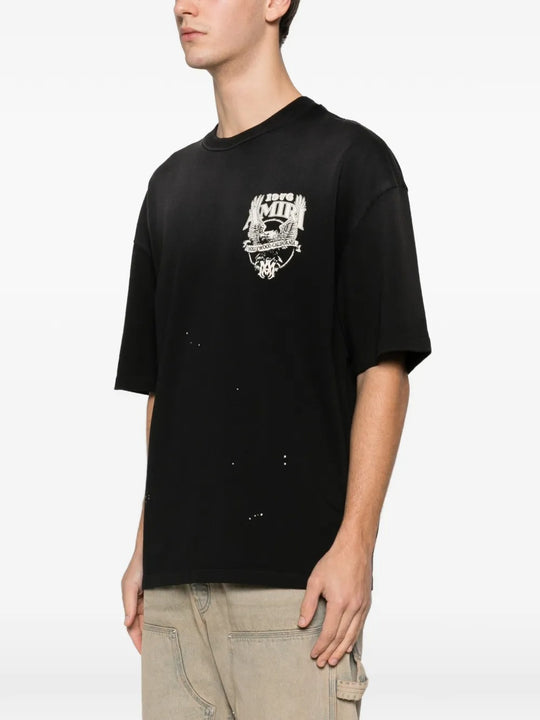 Black t-shirt worn by a person, showing the shirt's fit