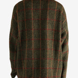 Green jacket worn by a person, showing the jacket's fit