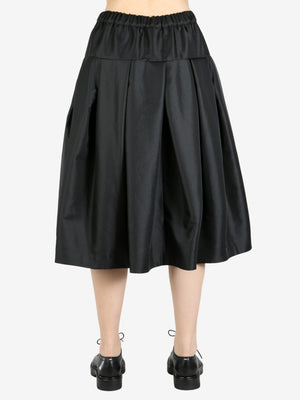 Black skirt worn by a person, showing the skirt's fit