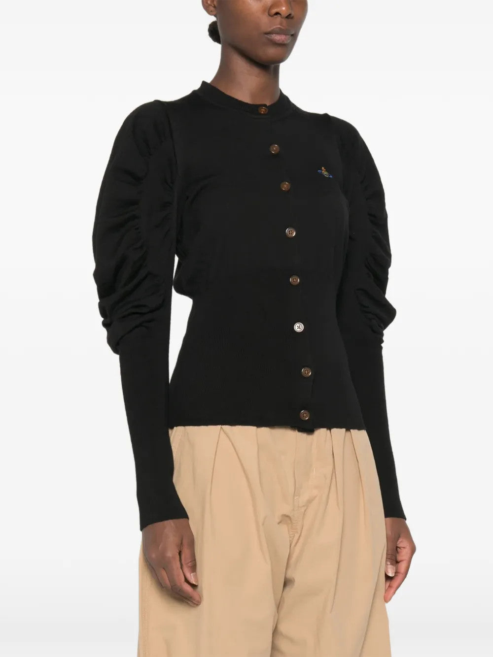 Black top worn by a person, showing the top fit