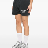Black shorts worn by a person, showing the pants's fit