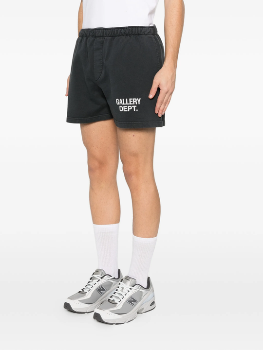 Black shorts worn by a person, showing the pants's fit