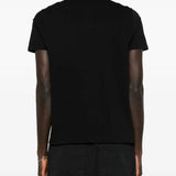 Black t-shirts worn by a person, showing the t-shirts fit