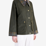 Green jacket worn by a person, showing the jacket fit