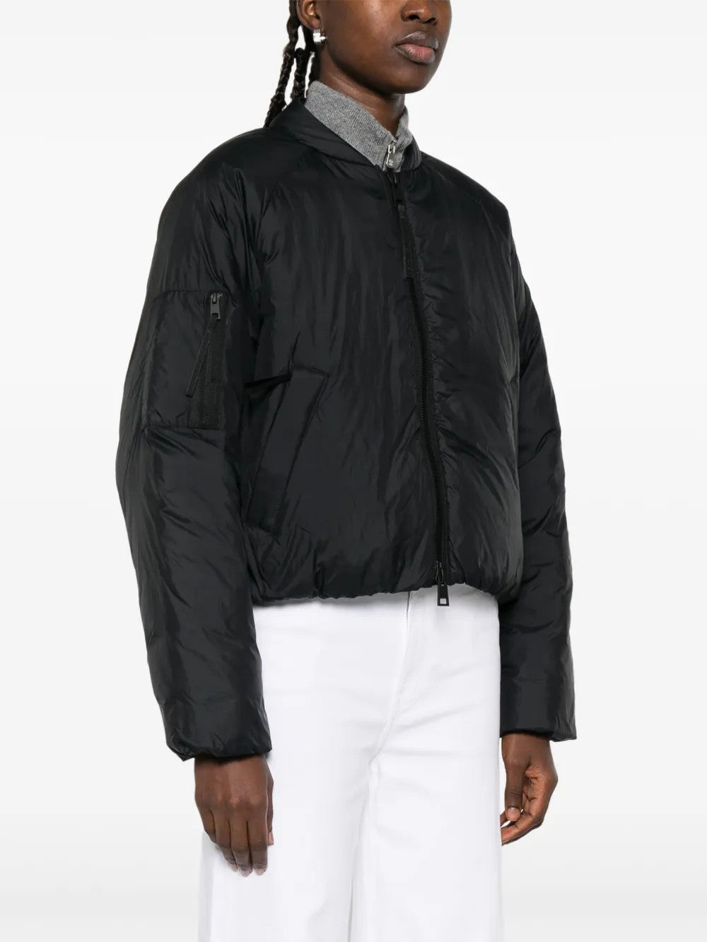 Black jacket worn by a person, showing the jacket fit