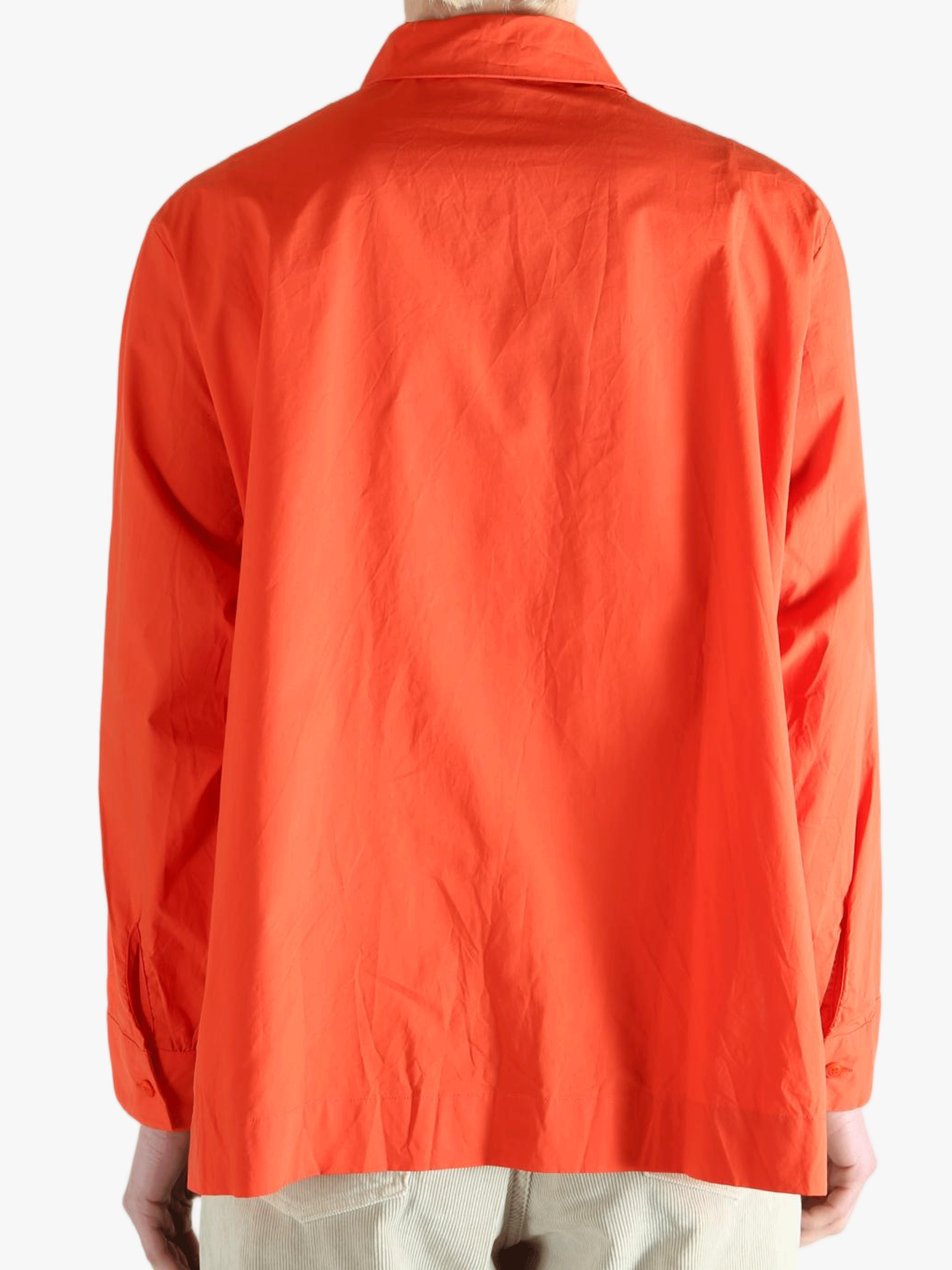 Red shirt worn by a person, showing the shirt's fit