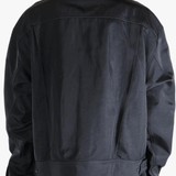 Black jacket worn by a person, showing the jackets fit