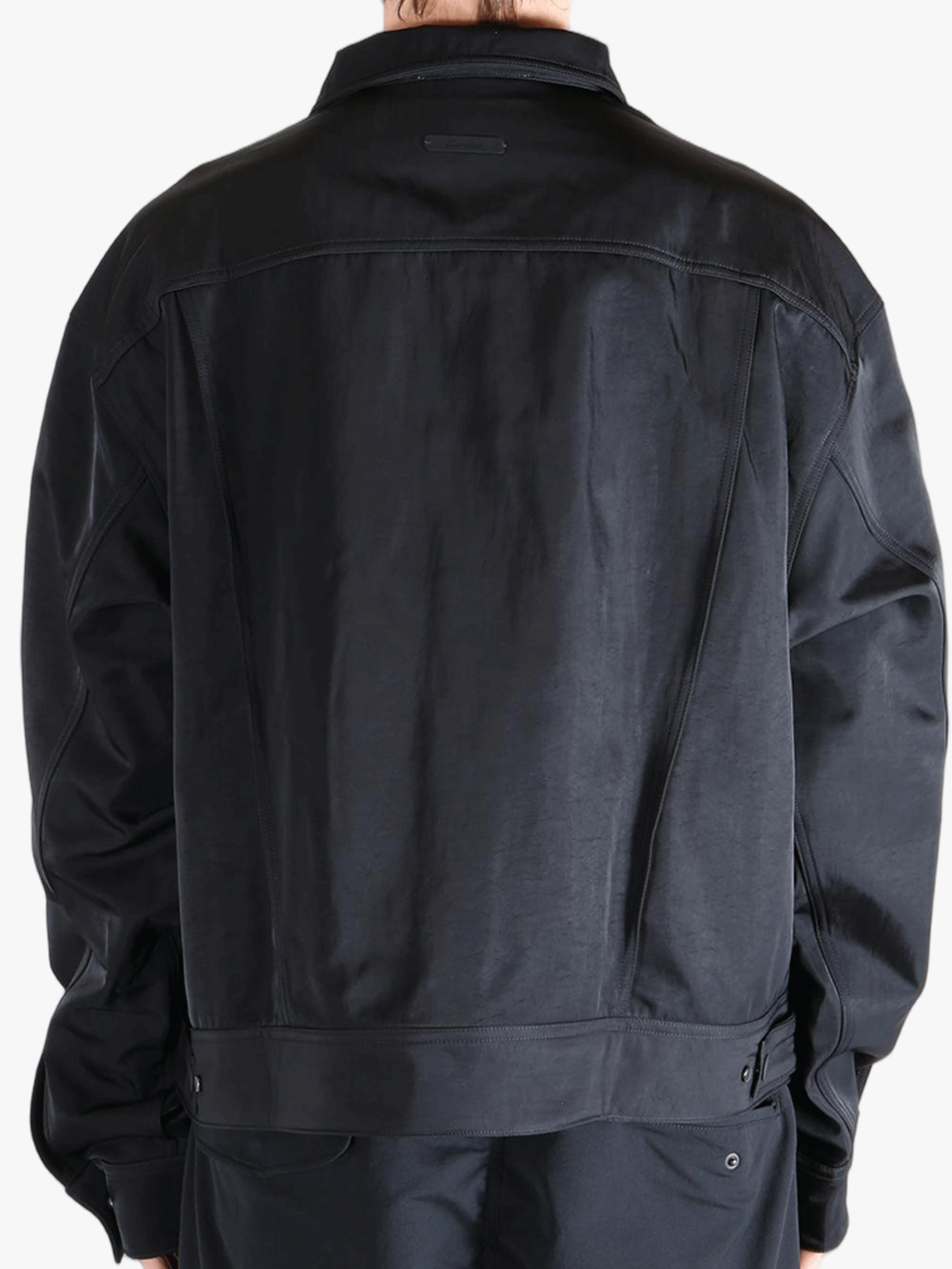 Black jacket worn by a person, showing the jackets fit