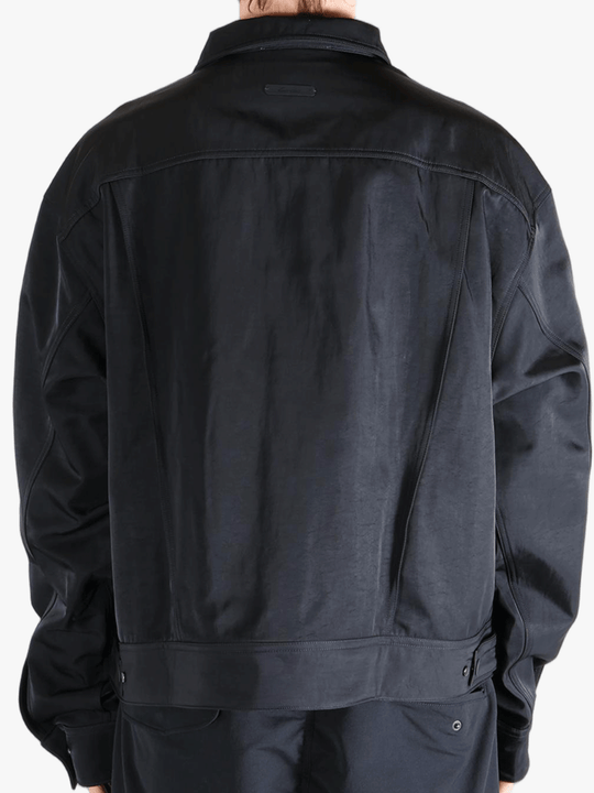 Black jacket worn by a person, showing the jackets fit