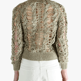 Green knitwear worn by a person, showing the knitwear fit