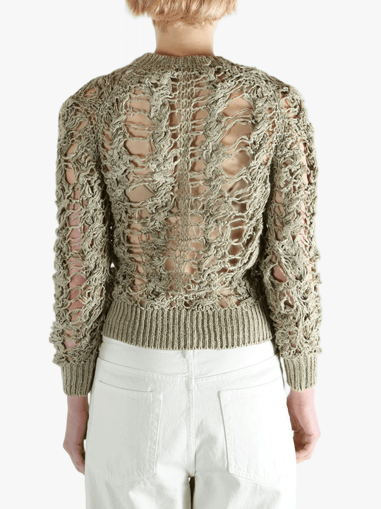 Green knitwear worn by a person, showing the knitwear fit