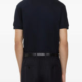 Navy polo worn by a person, showing the polo's fit