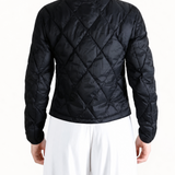 Black jacket worn by a person, showing the jacket fit