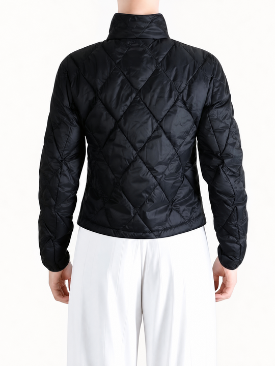 Black jacket worn by a person, showing the jacket fit