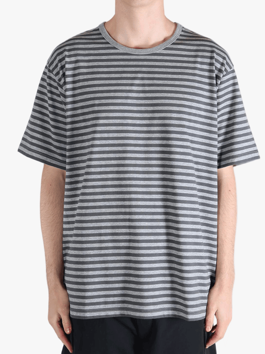 Grey t-shirt worn by a person, showing the t-shirt fit