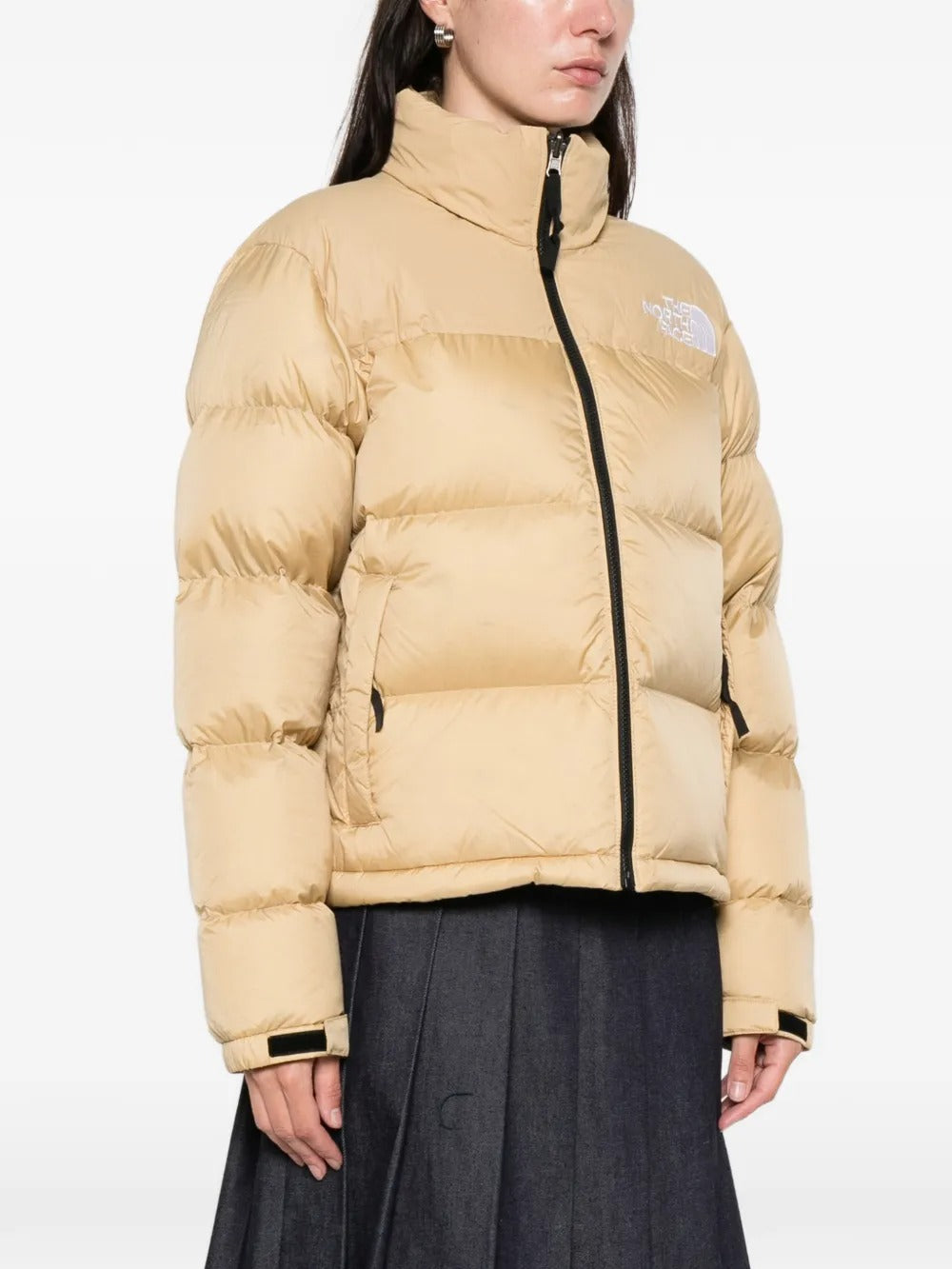 Tan jackets worn by a person, showing the  jackets fit