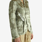 Green jacket worn by a person, showing the jacket fit