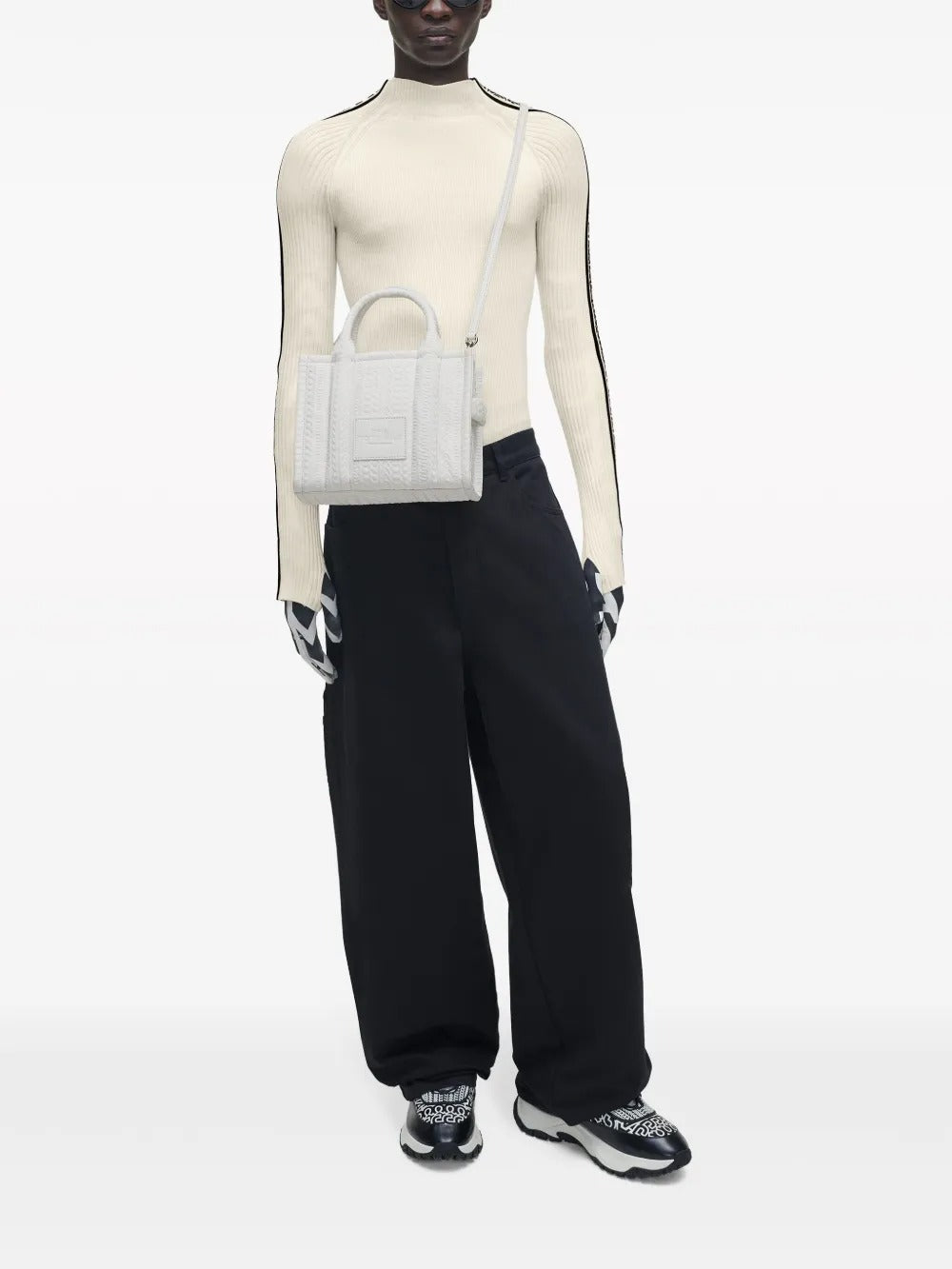 White bag worn by a person, showing the bag's fit