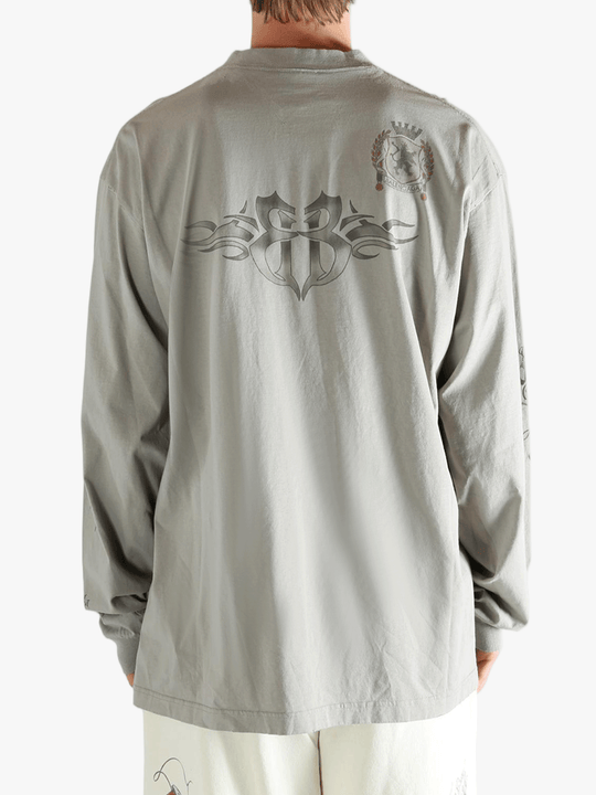 Grey tops worn by a person, showing the top fit