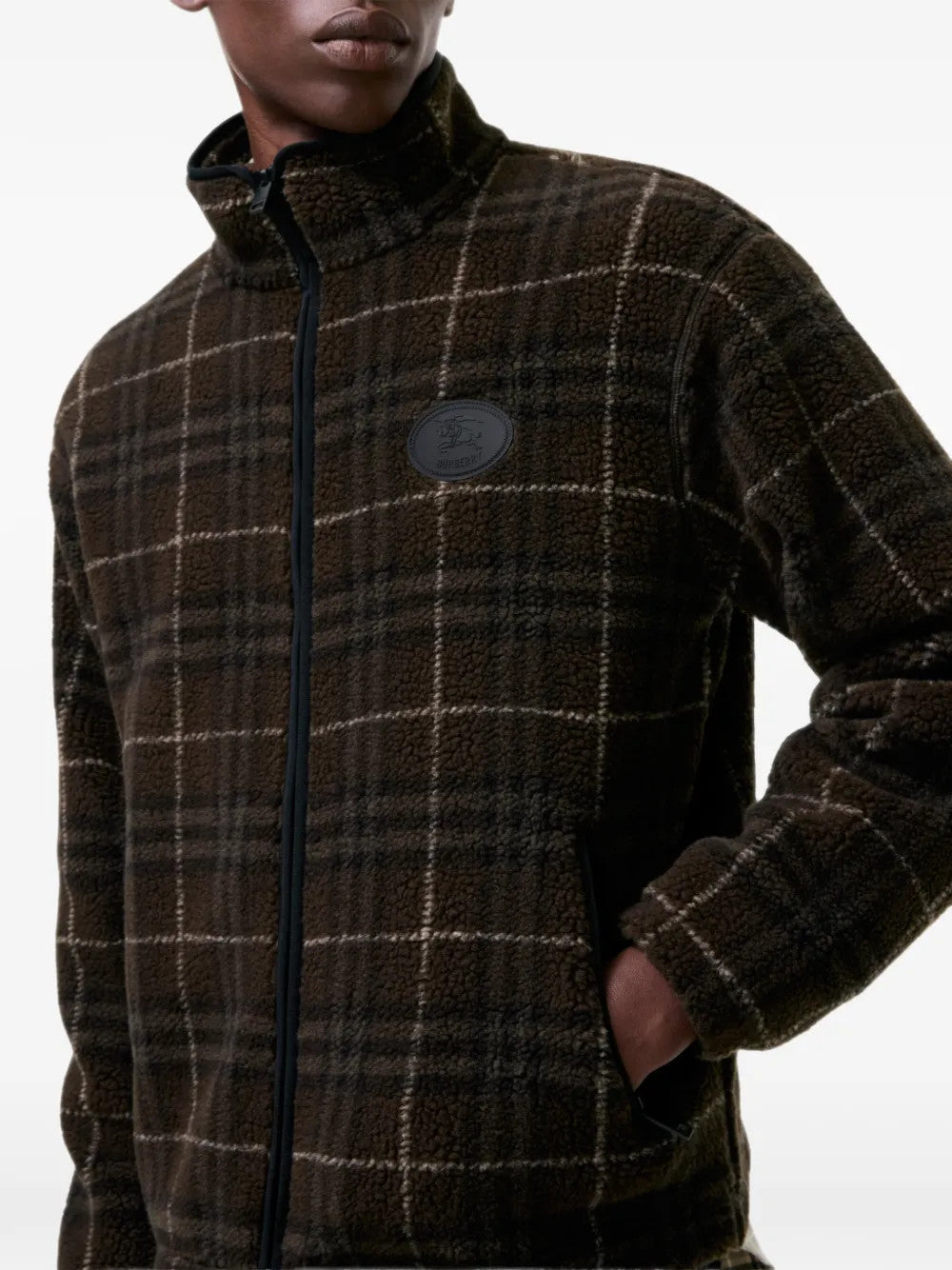 Brown jacket worn by a person, showing the jacket fit