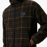 Brown jacket worn by a person, showing the jacket fit