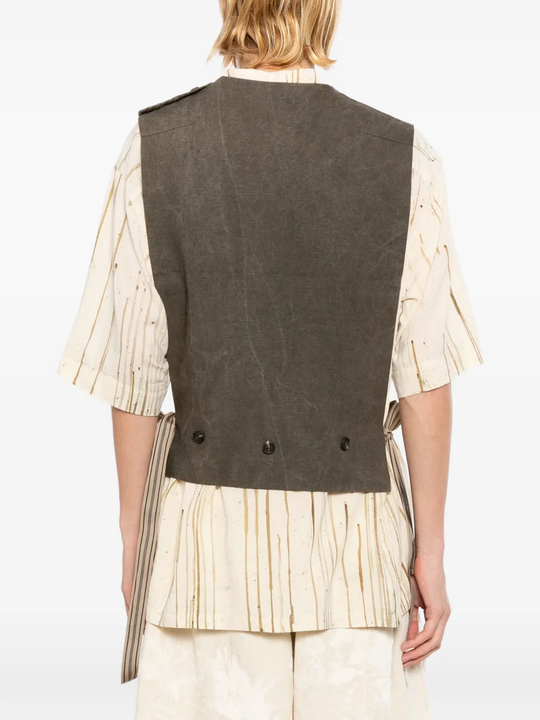 Brown vest worn by a person, showing the vest's fit