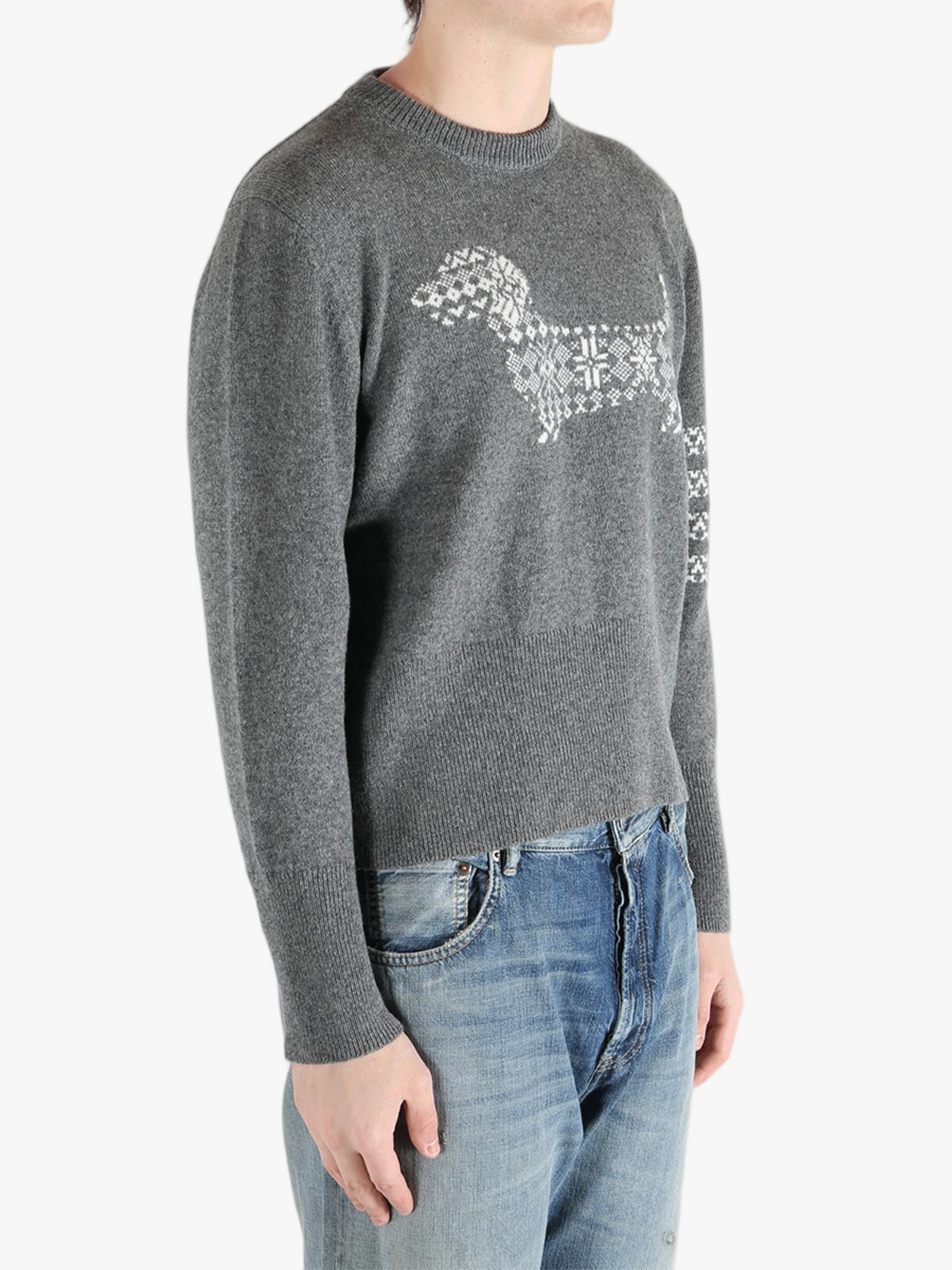 Grey knitwear worn by a person, showing the knitwear fit