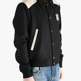 Black jacket worn by a person, showing the jacket's fit