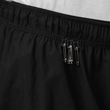 Close up of Black shorts, showing texture of the 82% polyamide/ 18% polyurethane fabric