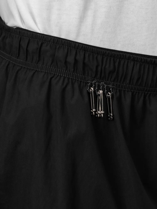 Close up of Black shorts, showing texture of the 82% polyamide/ 18% polyurethane fabric