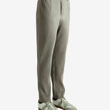 Grey pants worn by a person, showing the pants' fit