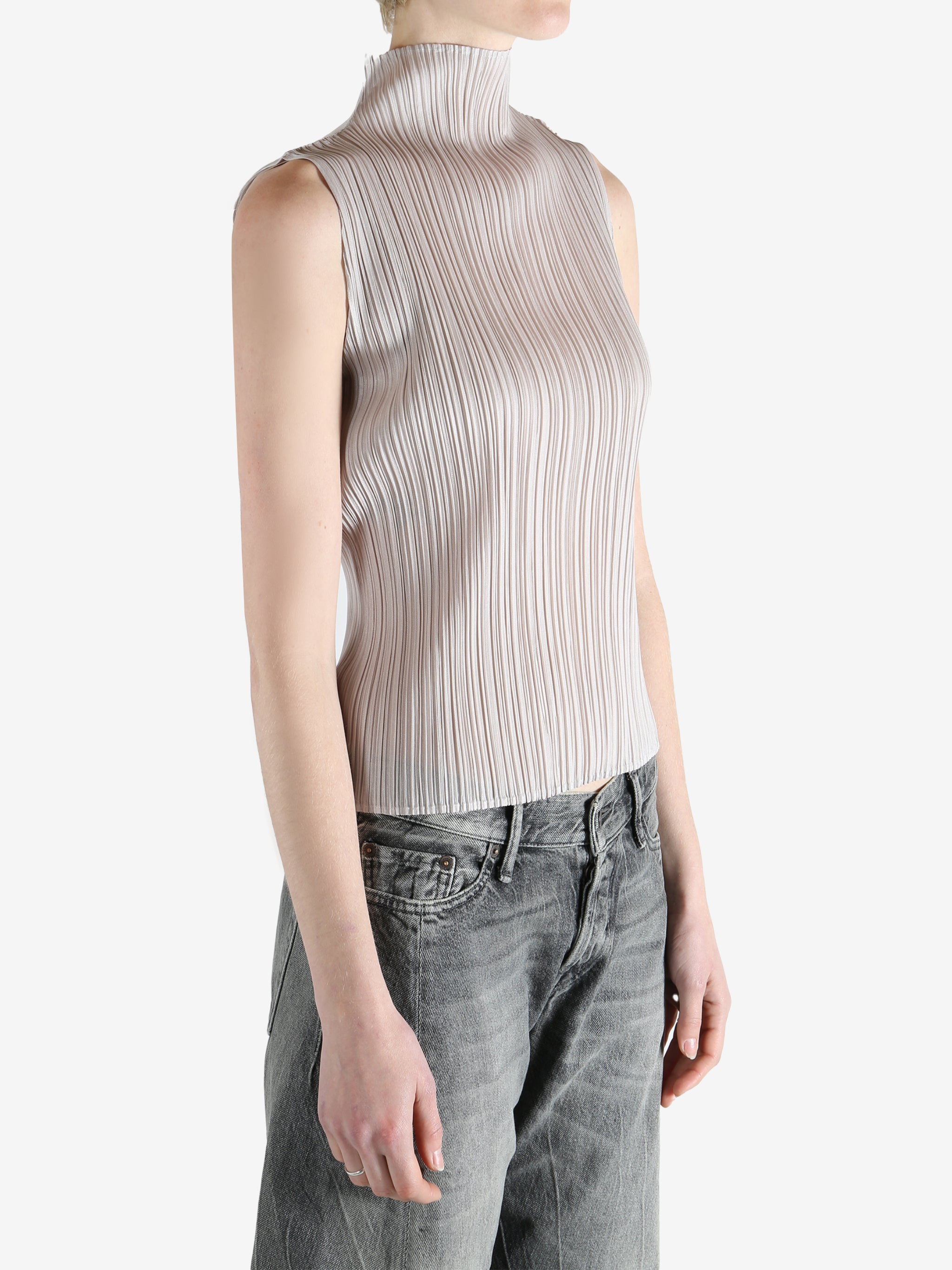 Grey tops worn by a person, showing the  tops fit