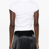 White t-shirt worn by a person, showing the shirt's fit