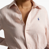 Pink knitwear worn by a person, showing the knitwear fit